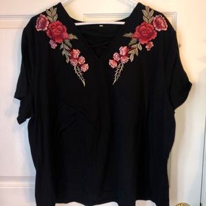 Black top with floral designs